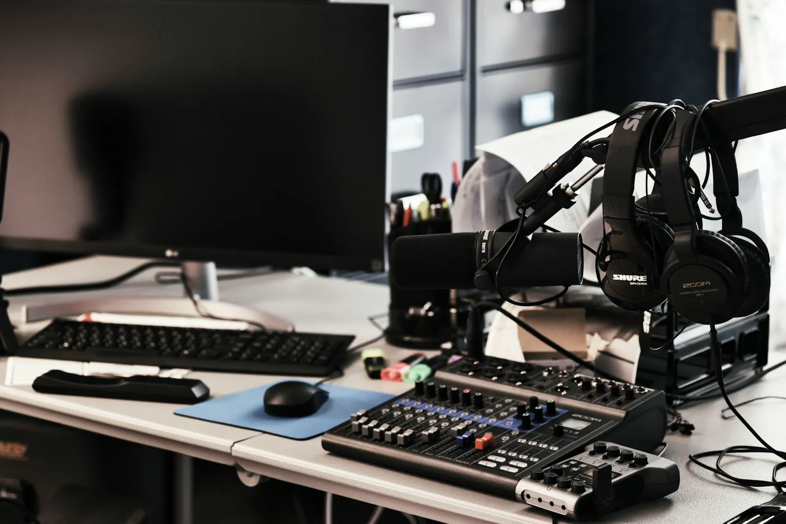 Headphones and a microphone in a creator's studio