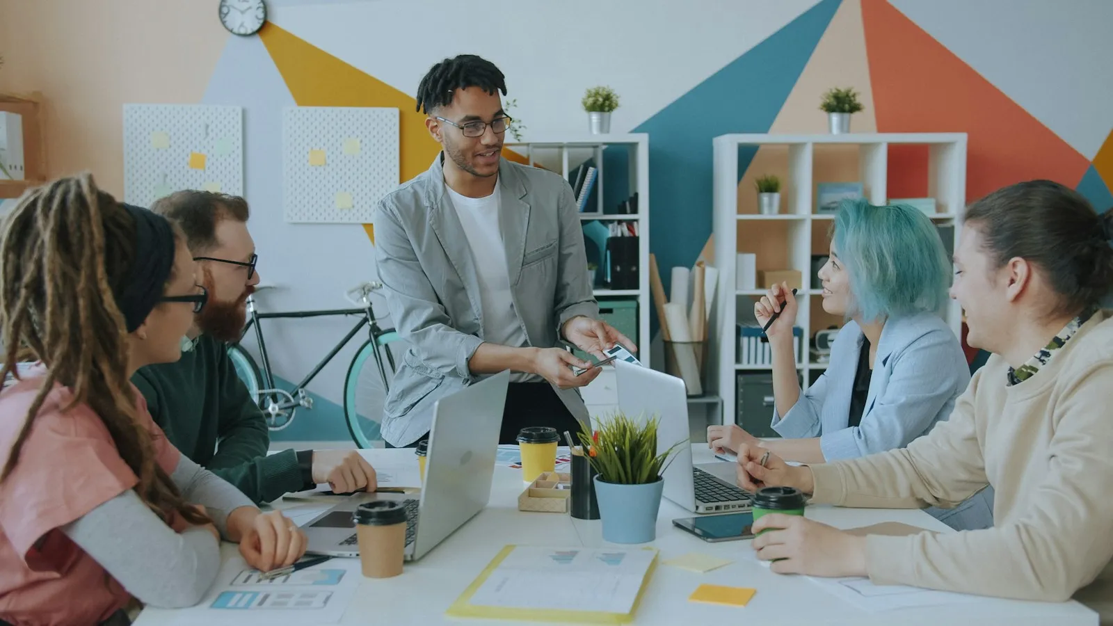 A marketing team talking around a desk